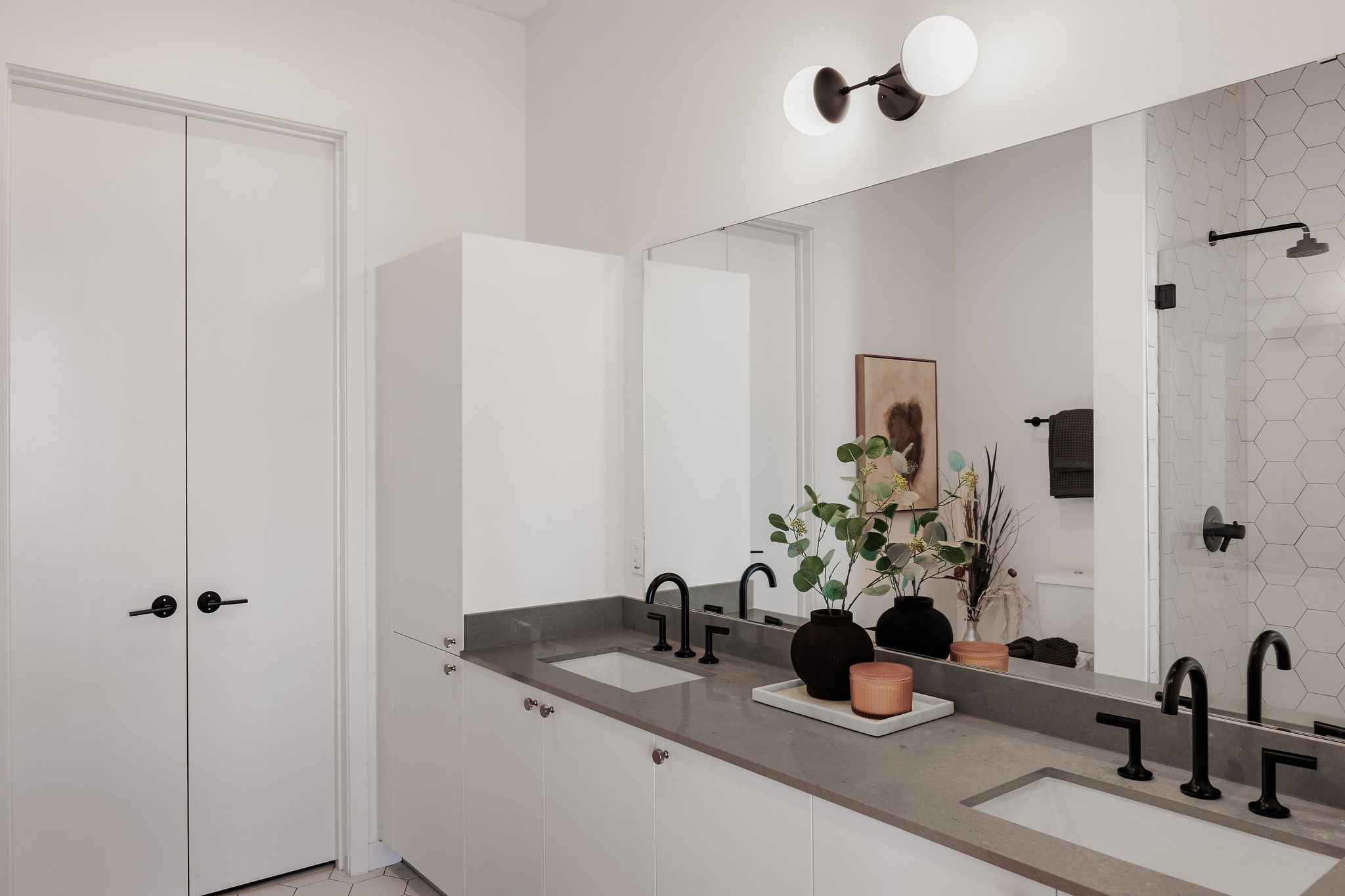 800 Embassy Drive, Unit 408 Austin, TX 78702 - Photo 16 of 30 Bathroom featuring double vanity and a shower