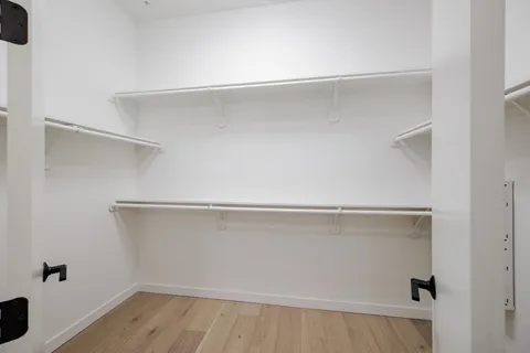 a view of an empty walk in closet