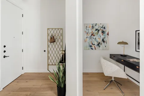 a view of a livingroom with furniture and wooden floor
