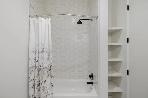 a bathroom with a bathtub