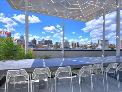 a outdoor dining space with furniture and a potted plants
