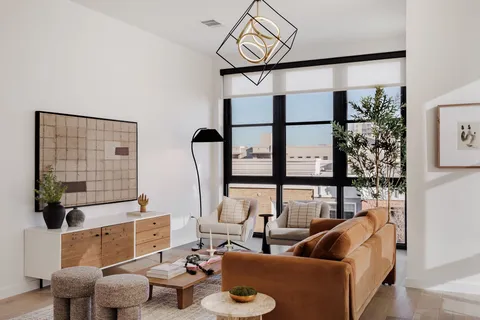 a living room with furniture and a window