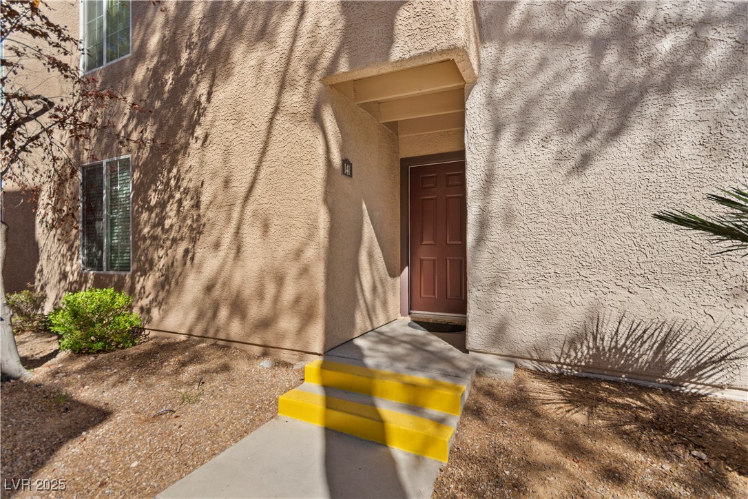9325 West Desert Inn Road, Unit 141 Las Vegas, NV 89117 - Photo 14 of 30 Entrance to property with stucco siding