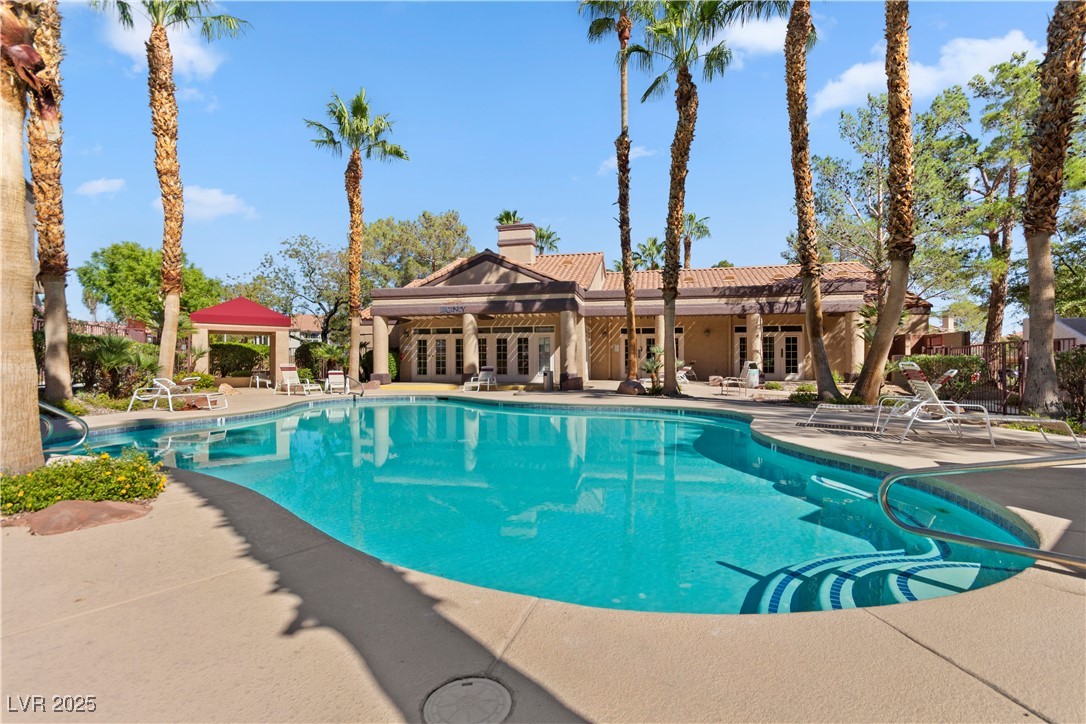 9325 West Desert Inn Road, Unit 141 Las Vegas, NV 89117 - Photo 19 of 30 Community pool with french doors, a patio area, and a gazebo