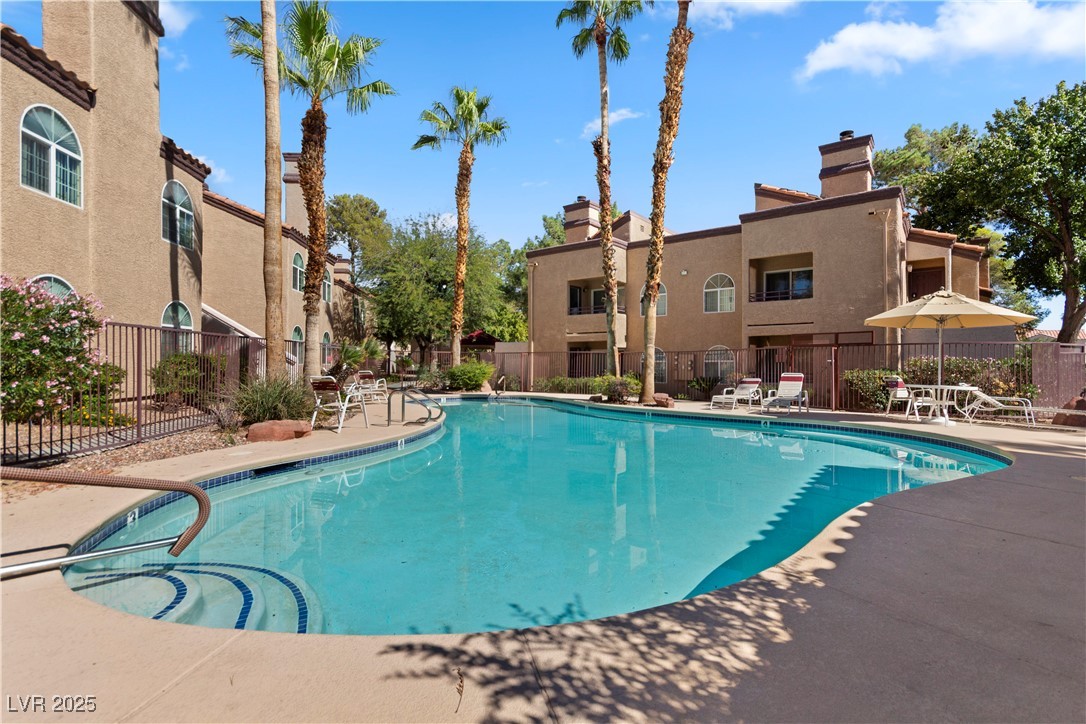 9325 West Desert Inn Road, Unit 141 Las Vegas, NV 89117 - Photo 24 of 30 Community pool featuring a patio area