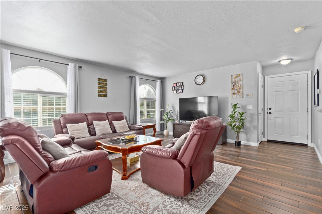9325 West Desert Inn Road, Unit 141 Las Vegas, NV 89117 - Photo 3 of 30 Living room with tile floors and baseboards