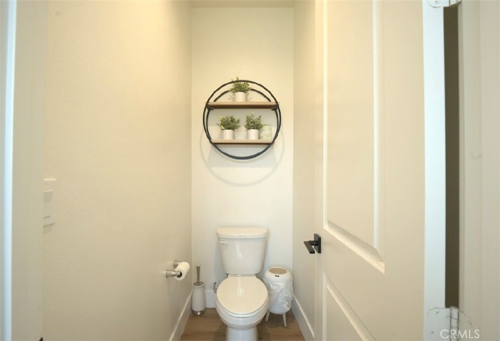 14159 Eclipse Street Moreno Valley, CA 92555 - Photo 13 of 27 a bathroom with a toilet and a sink