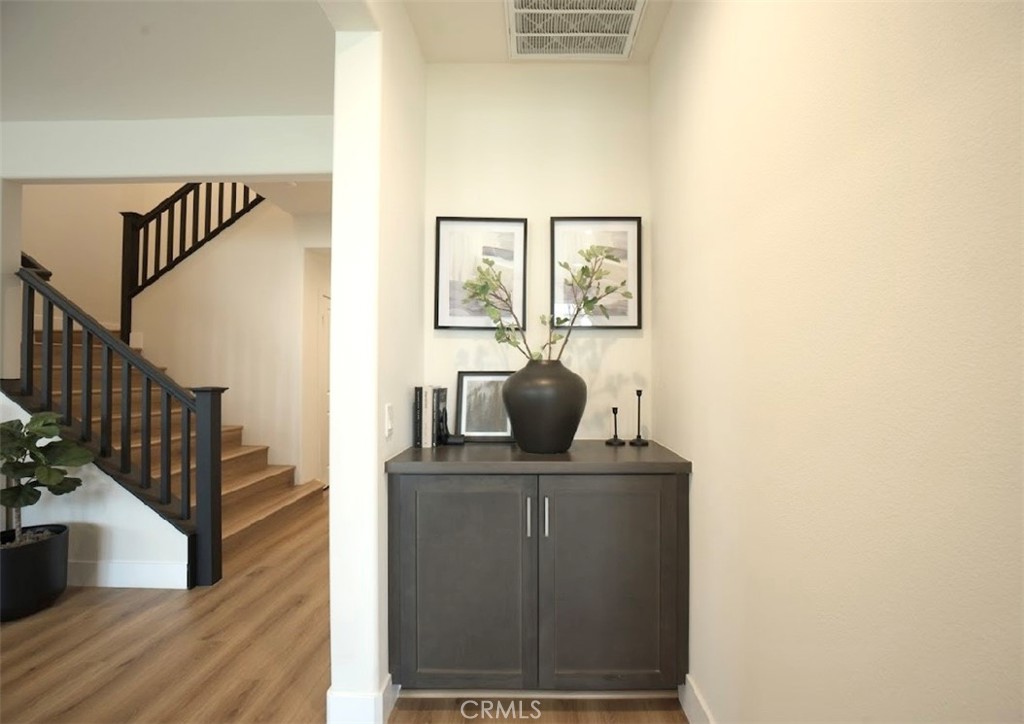 14159 Eclipse Street Moreno Valley, CA 92555 - Photo 15 of 27 a view of workspace with wooden floor windows