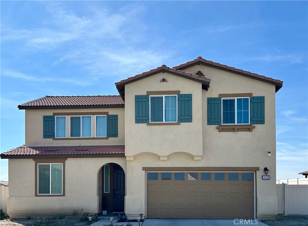 14159 Eclipse Street Moreno Valley, CA 92555 - Photo 2 of 27 a front view of a house with windows