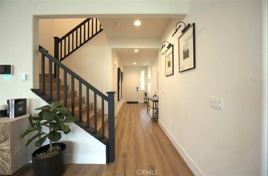 14159 Eclipse Street Moreno Valley, CA 92555 - Photo 5 of 27 a view of entryway and hall with wooden floor