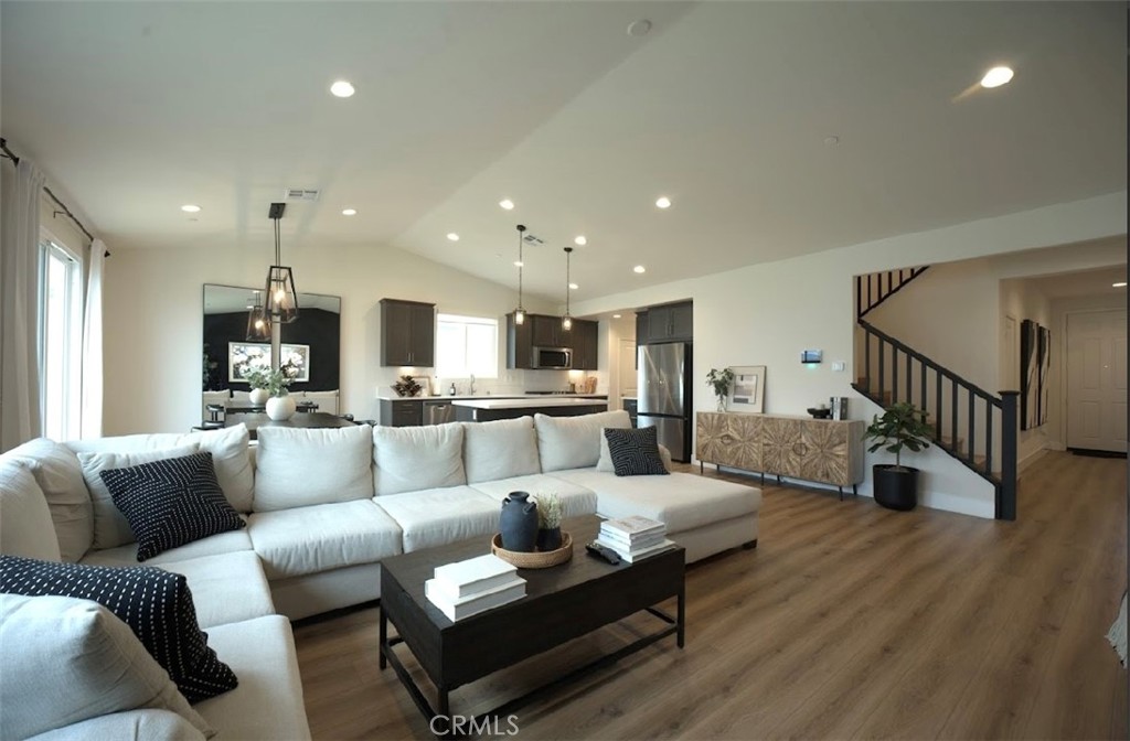 14159 Eclipse Street Moreno Valley, CA 92555 - Photo 6 of 27 a living room with furniture or kitchen view and a wooden floor