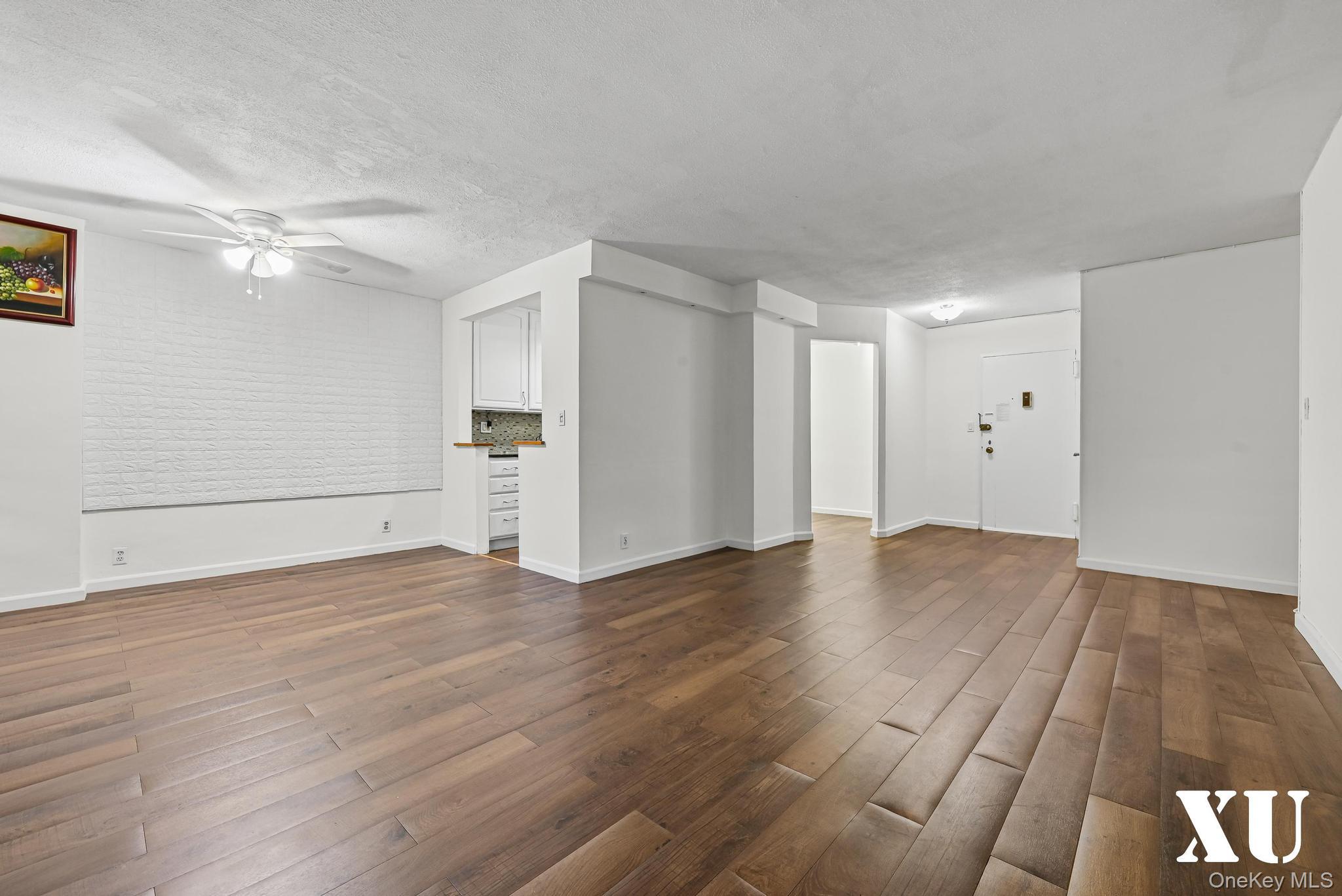 43-10 Kissena Boulevard, Unit 2B Queens, NY 11355 - Photo 2 of 23 a view of empty room with wooden floor