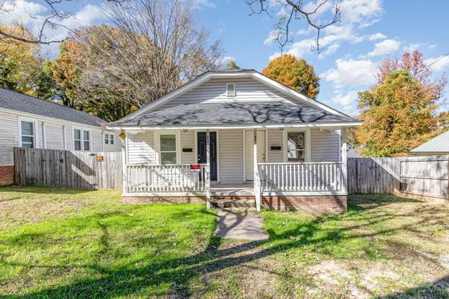 a house with garden in front of it