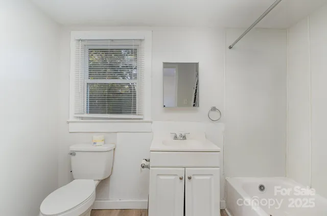 a bathroom with a sink toilet and tub