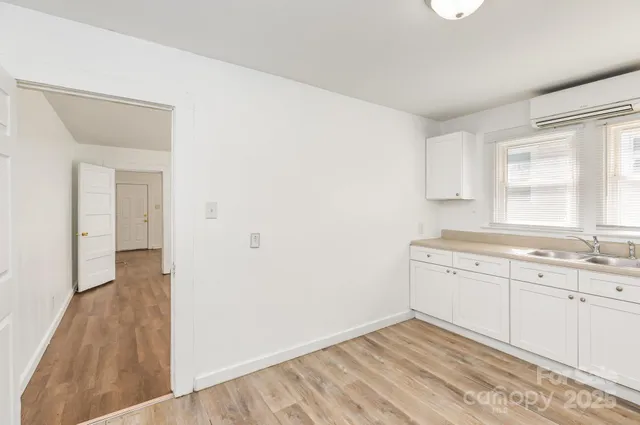 a view of a kitchen with a sink