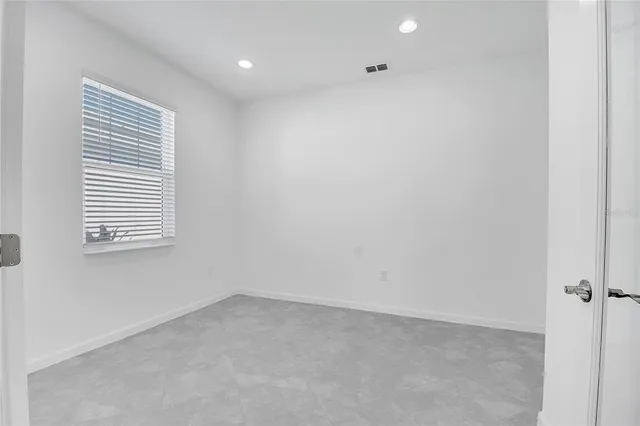 a view of empty room with windows