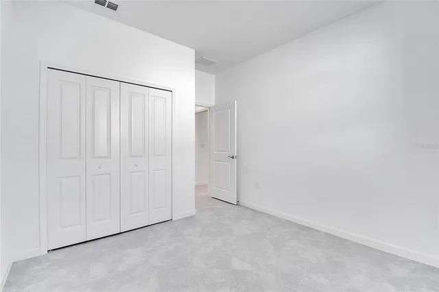 a view of an empty room with a large window