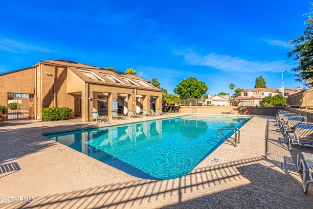 a view of a water fountain with potted plants
