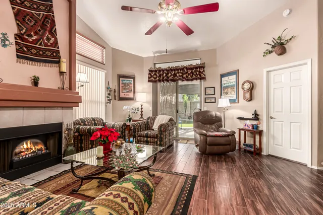 a living room with furniture and a fireplace