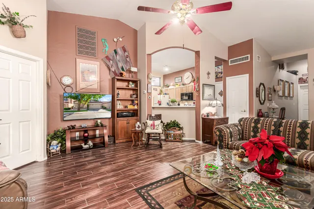 a living room filled with furniture and wooden floor