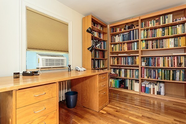 46 Lansdowne Road Arlington, MA 02474 - Photo 19 of 29 a view of a workspace with furniture and a book shelf