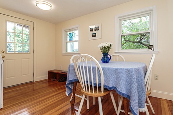 46 Lansdowne Road Arlington, MA 02474 - Photo 8 of 29 a view of a dining room with furniture a chandelier and wooden floor