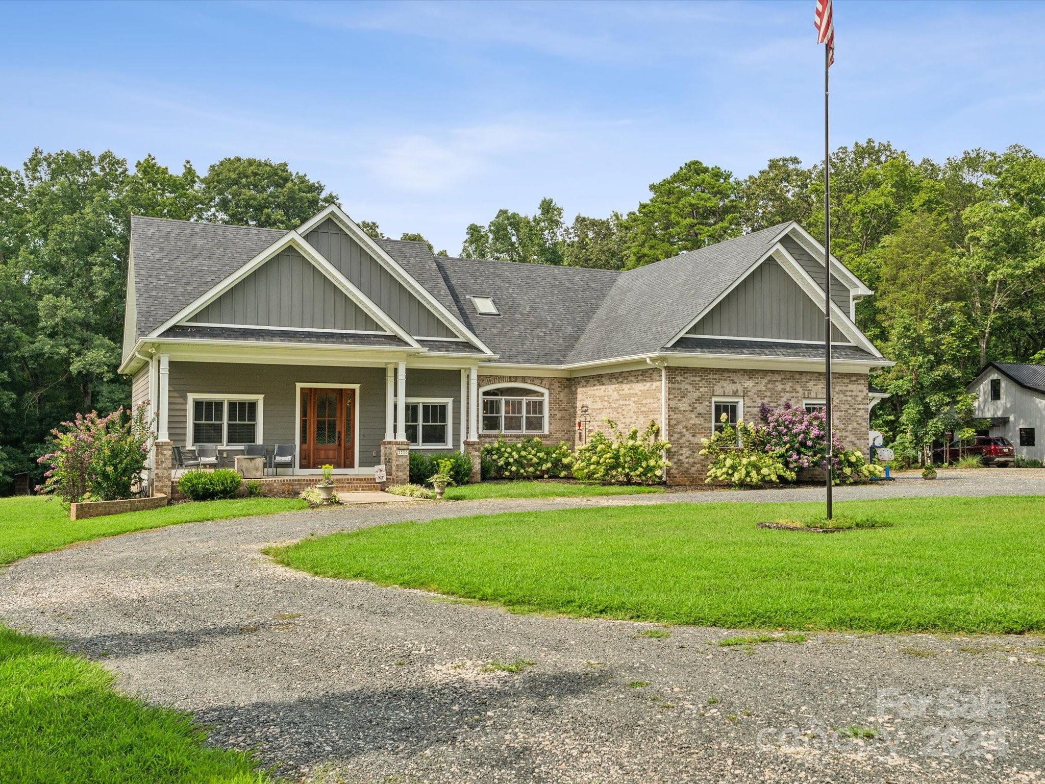 1156 Williams Road Fort Mill, SC 29715 - Photo 1 of 44 a front view of a house with a yard and trees