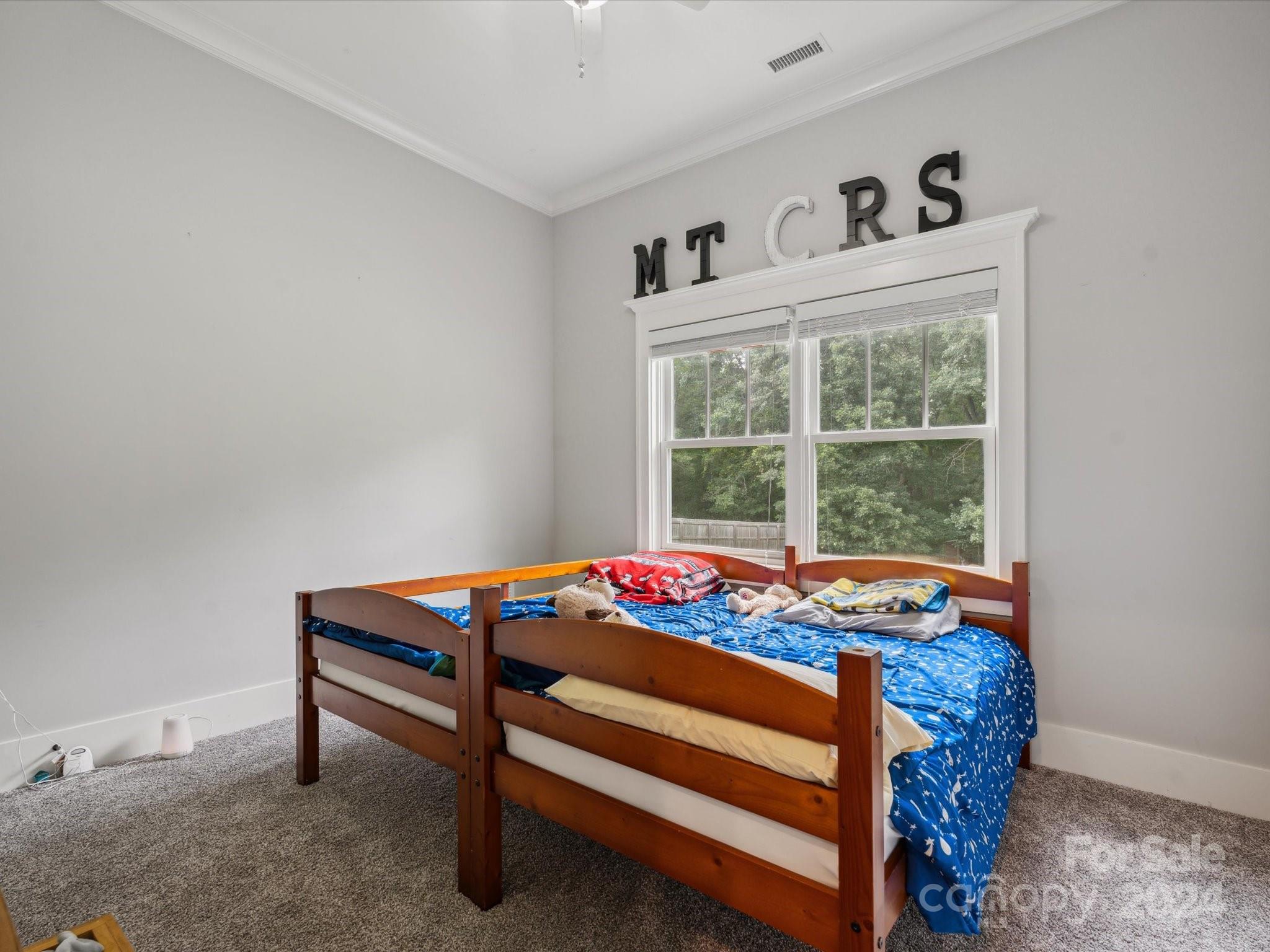 1156 Williams Road Fort Mill, SC 29715 - Photo 12 of 44 a bed sitting in a bedroom next to a window