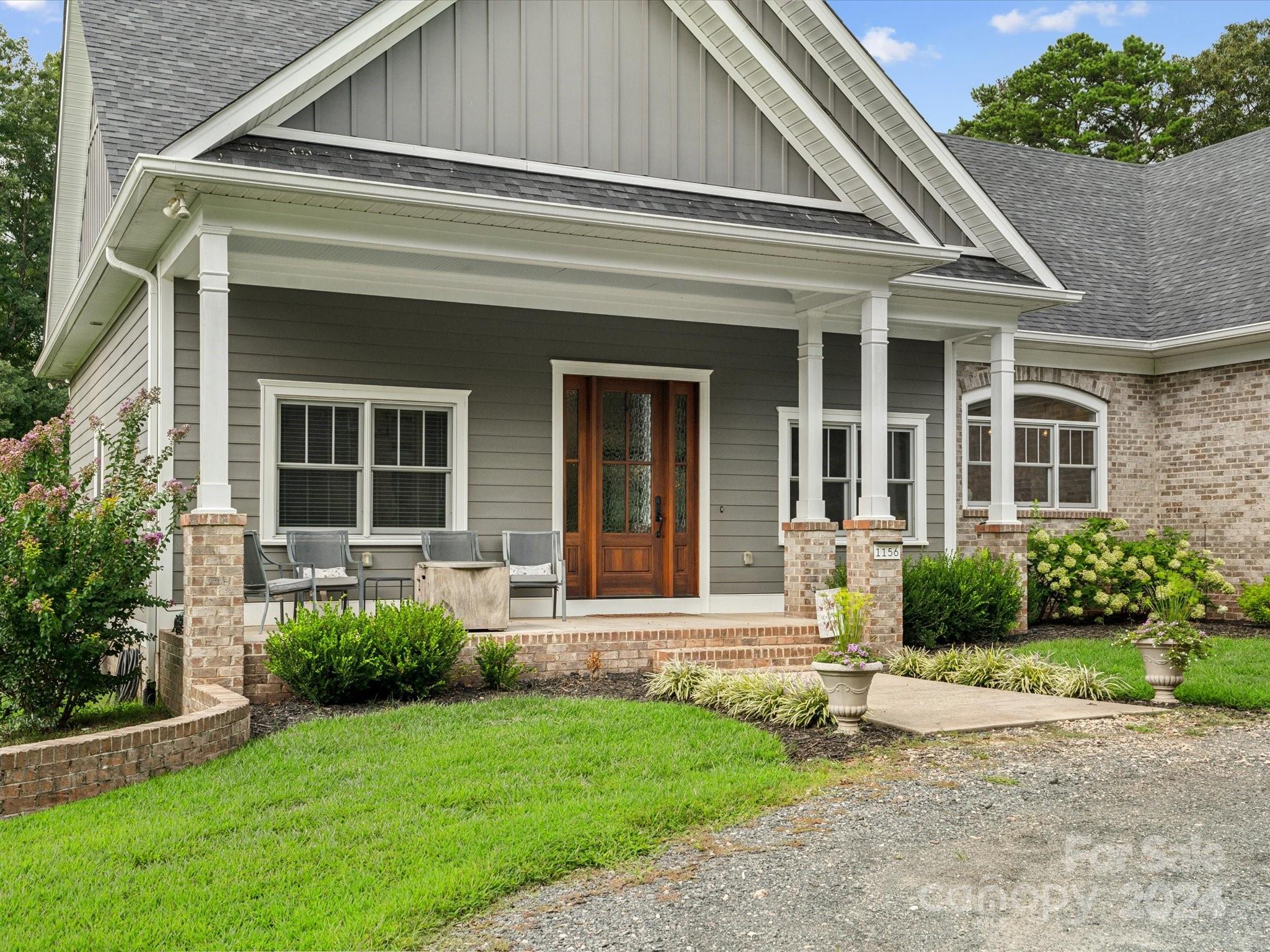1156 Williams Road Fort Mill, SC 29715 - Photo 2 of 44 a front view of a house with garden