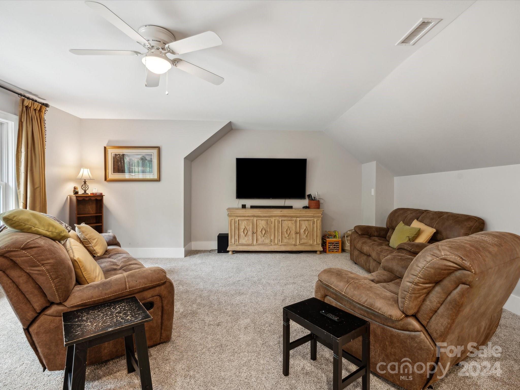 1156 Williams Road Fort Mill, SC 29715 - Photo 25 of 44 a living room with furniture and a flat screen tv