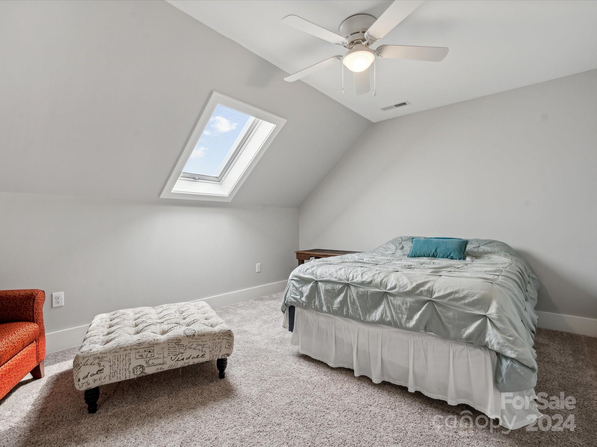 1156 Williams Road Fort Mill, SC 29715 - Photo 29 of 44 a bedroom with a bed and a chandelier fan