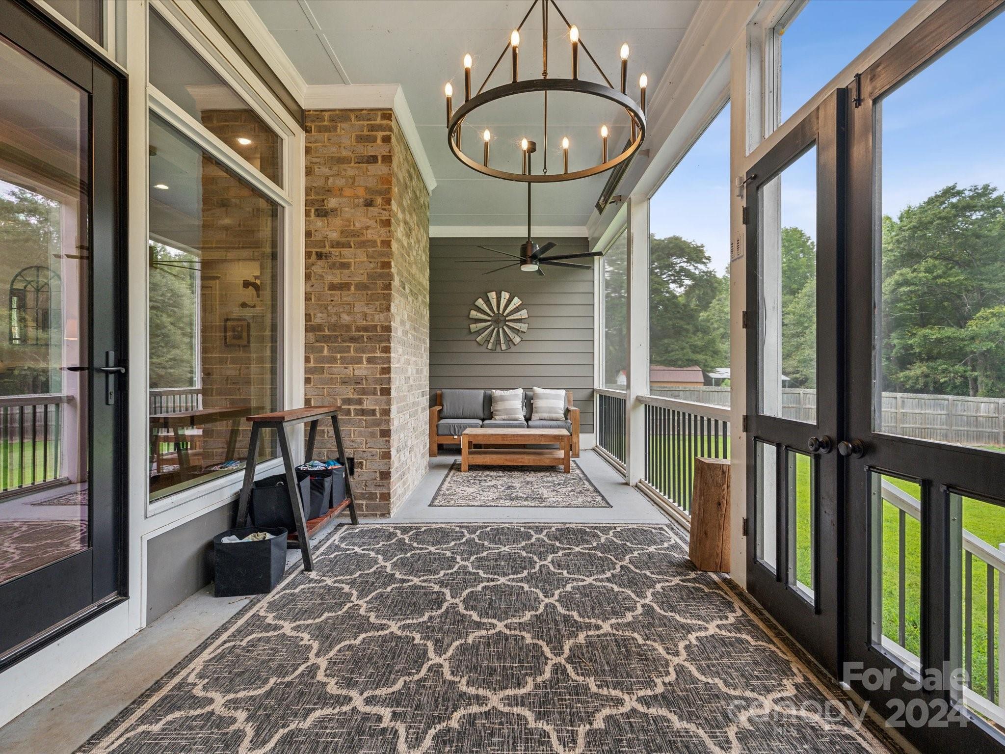1156 Williams Road Fort Mill, SC 29715 - Photo 30 of 44 a view of a porch with a table and chairs