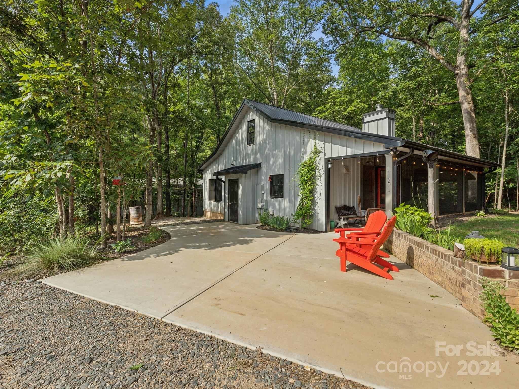 1156 Williams Road Fort Mill, SC 29715 - Photo 33 of 44 a wooden bench sitting in front of a house