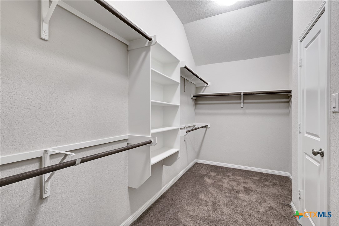 32144 Cardamom Way Bulverde, TX 78163 - Photo 17 of 30 a view of an empty walk in closet