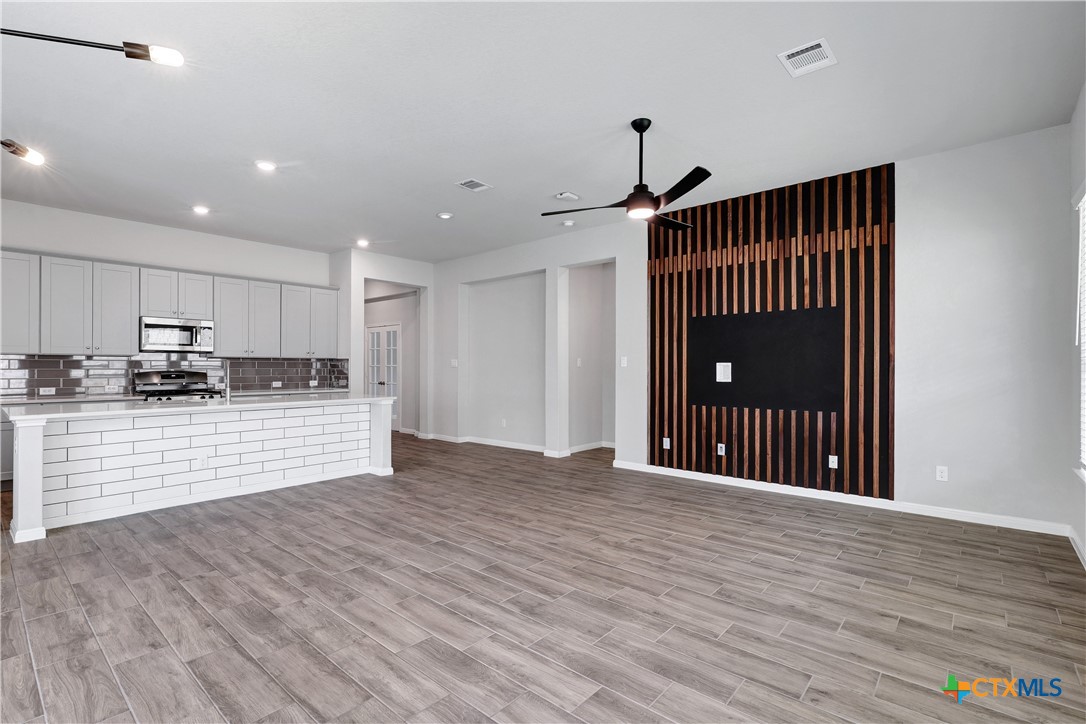 32144 Cardamom Way Bulverde, TX 78163 - Photo 10 of 30 a view of large kitchen with wooden floor