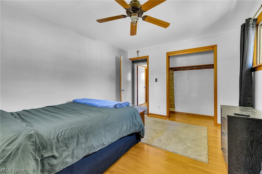 4685 New Road Youngstown, OH 44515 - Photo 21 of 37 Bedroom with light wood-type flooring, ceiling fan, and a closet