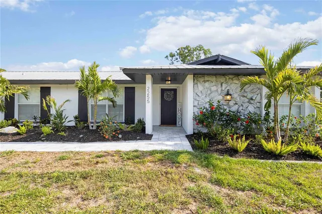 a view of a house with fountain bath and swimming pool