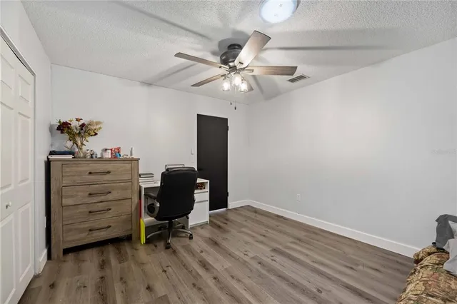 a room with cabinets and wooden floor