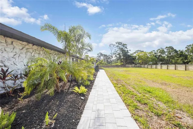 a view of swimming pool with a yard
