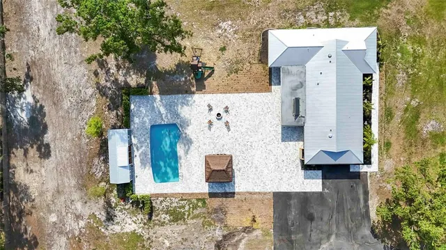 an aerial view of residential houses with outdoor space