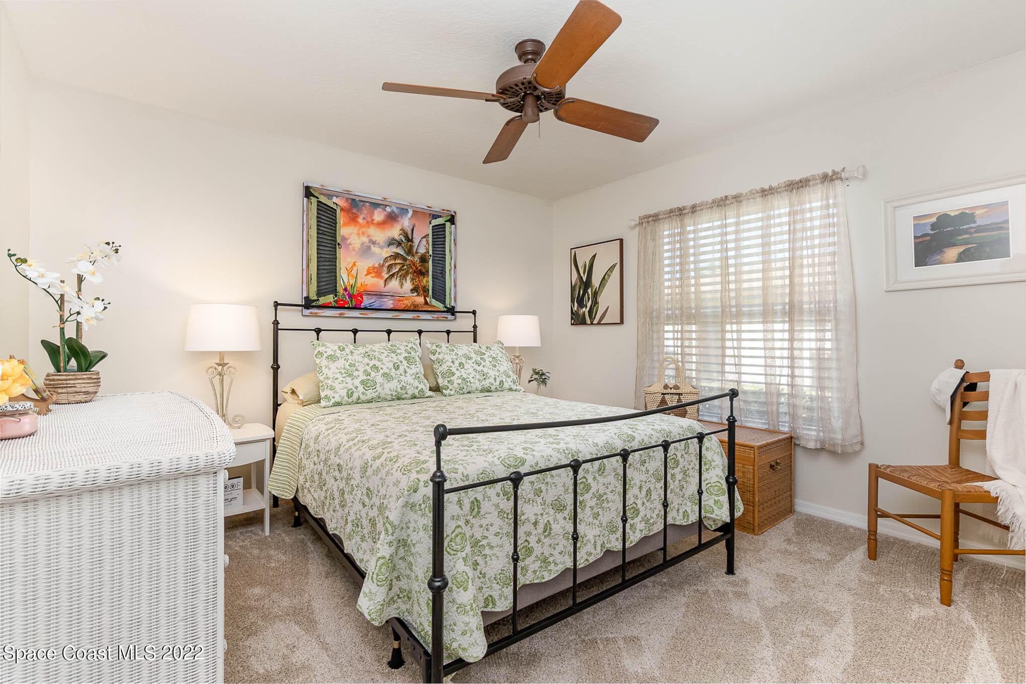 1496 Meadowbrook Road Northeast Palm Bay, FL 32905 - Photo 21 of 25 a bedroom with a bed and a table