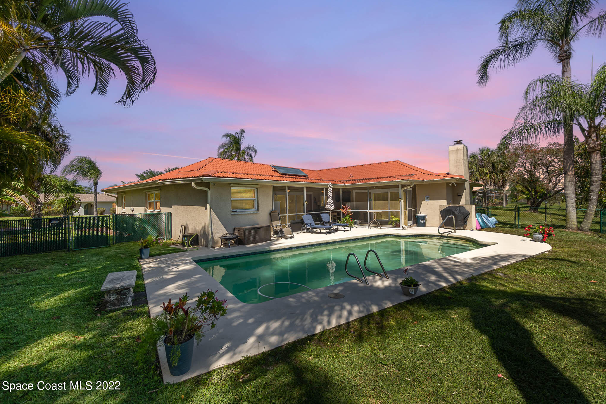 1496 Meadowbrook Road Northeast Palm Bay, FL 32905 - Photo 6 of 25 a front view of house with yard and outdoor seating