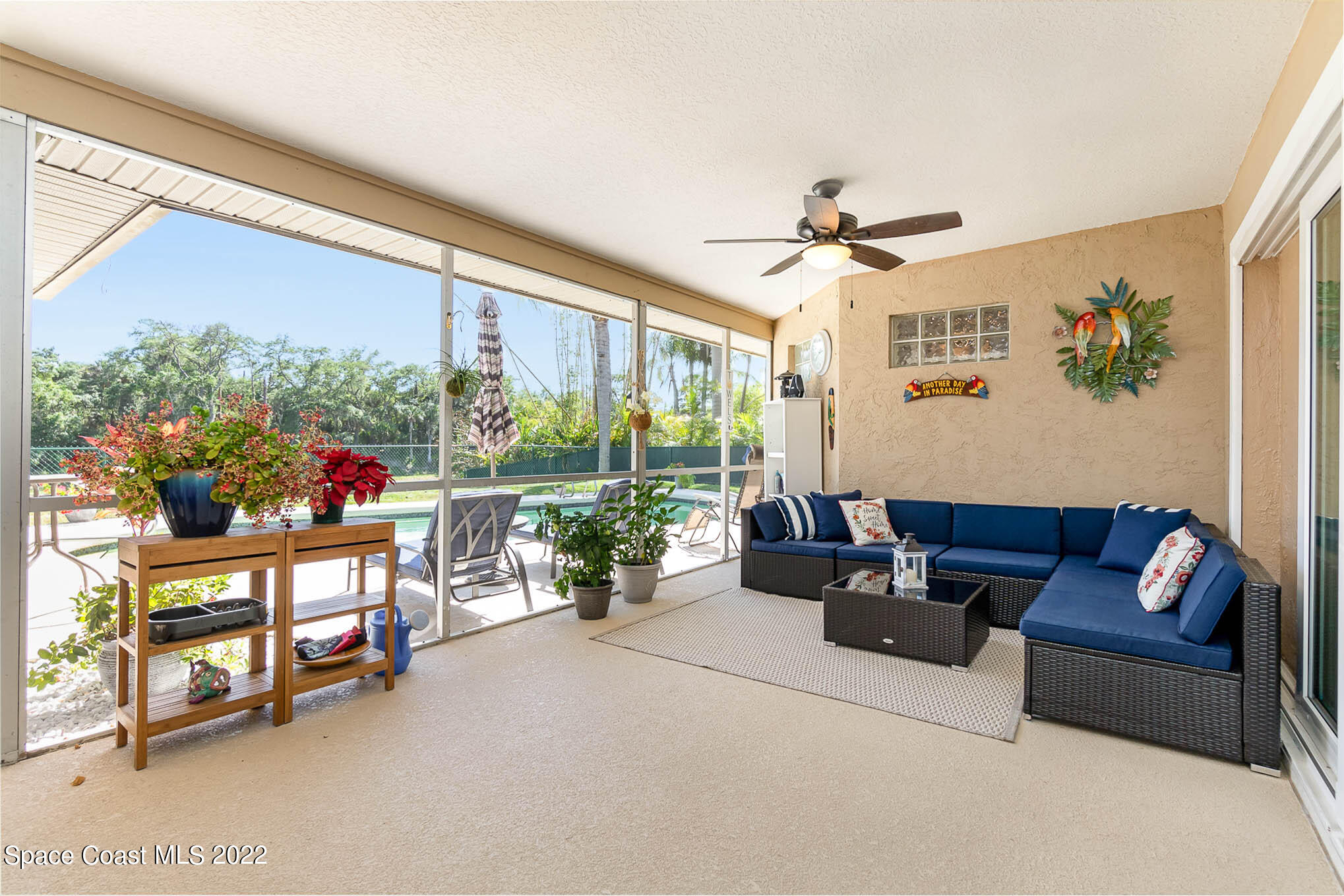 1496 Meadowbrook Road Northeast Palm Bay, FL 32905 - Photo 7 of 25 a living room with furniture and a large window
