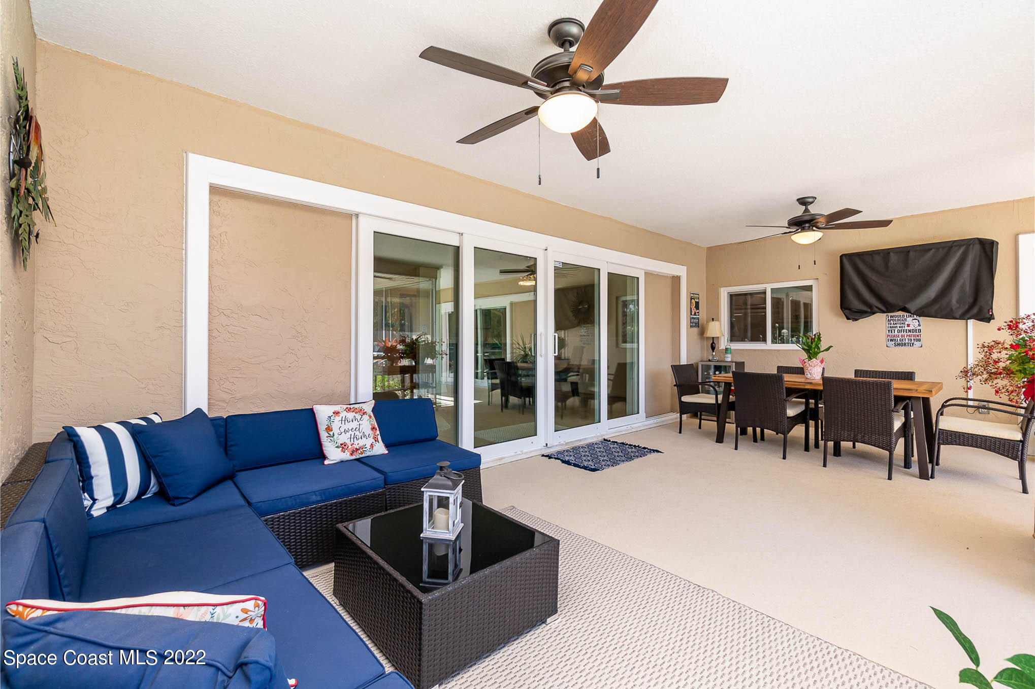1496 Meadowbrook Road Northeast Palm Bay, FL 32905 - Photo 8 of 25 a living room with furniture and a large window