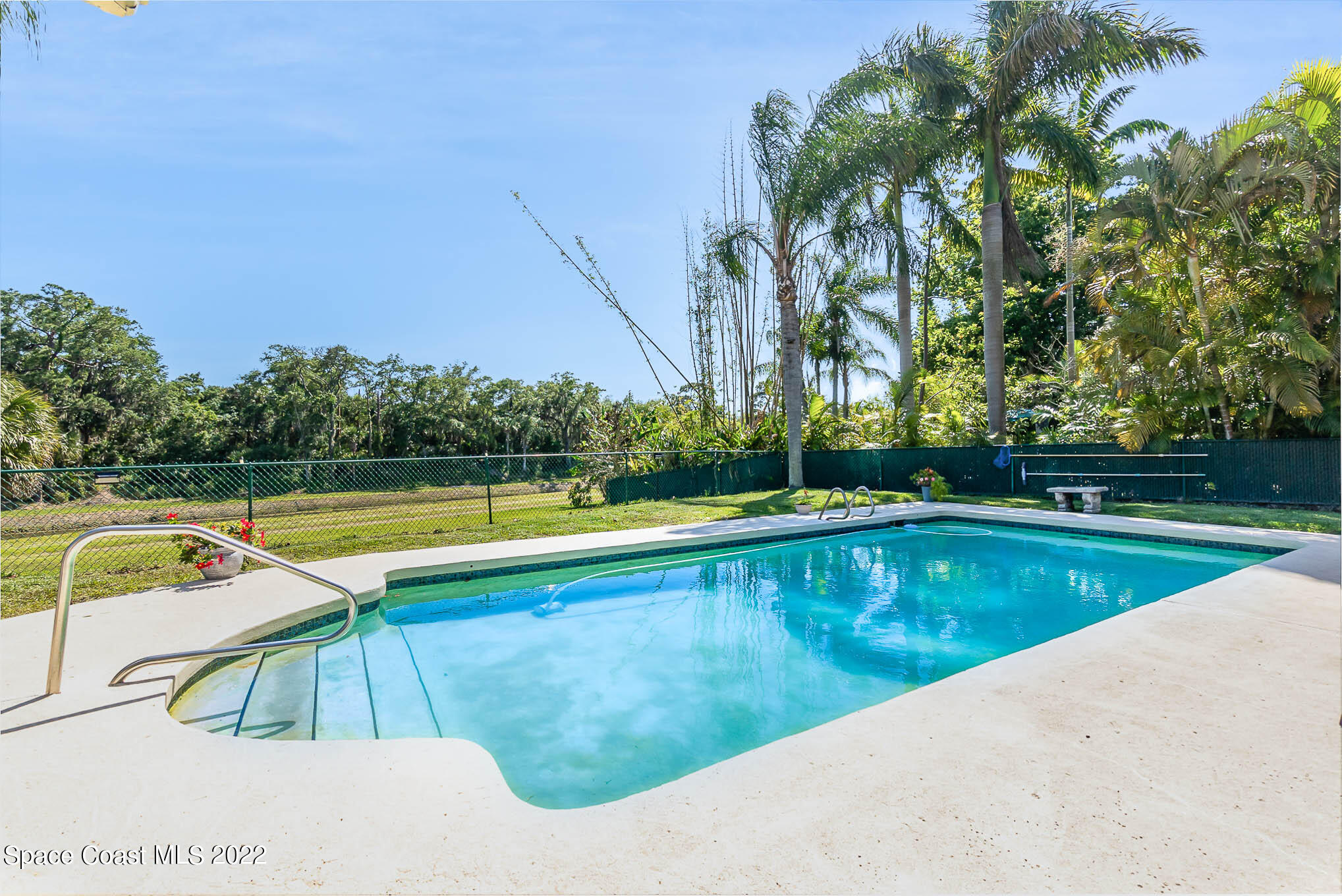 1496 Meadowbrook Road Northeast Palm Bay, FL 32905 - Photo 9 of 25 a view of swimming pool with chairs