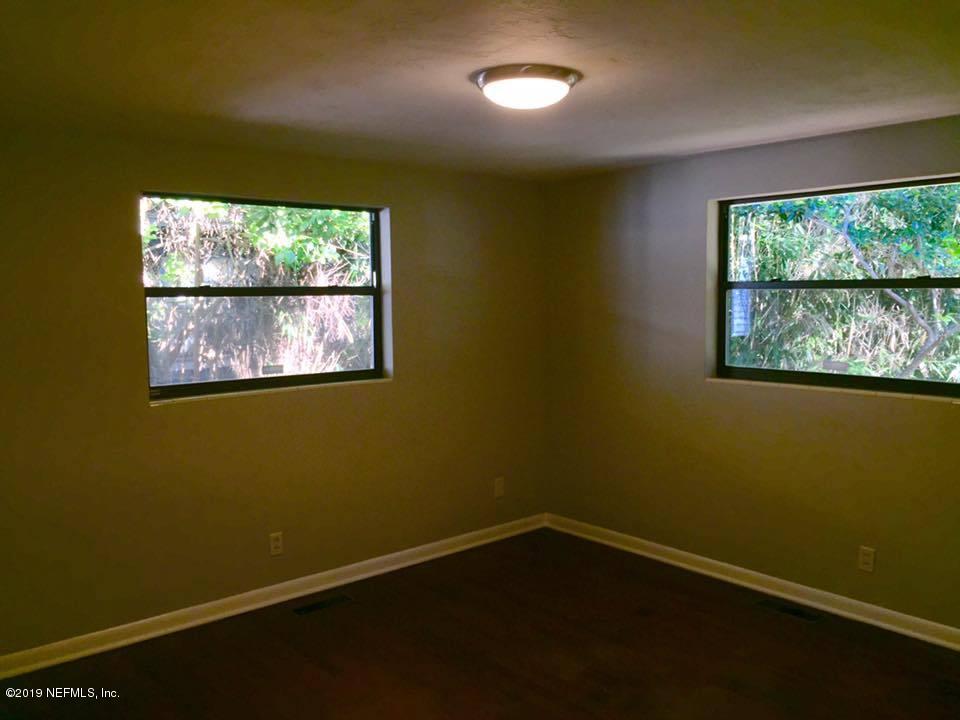 5107 Spring Glen Road Jacksonville, FL 32207 - Photo 6 of 16 an empty room with a window