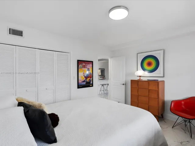 a bedroom with a bed and a cabinets