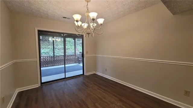 a view of a porch with wooden floor