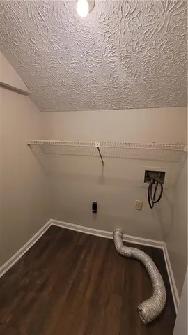 a view of empty room with wooden walls