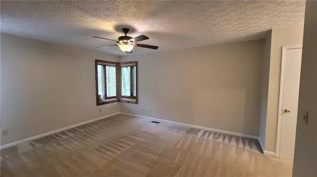 a bathroom with a double vanity sink a toilet and a mirror